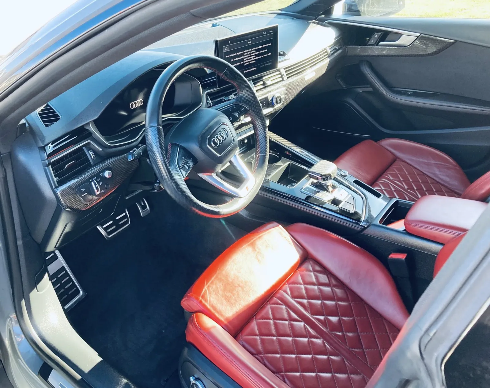 Luxury vehicle interior deep clean — perforated leather seats and steam-cleaned dashboard by Executive Detail Utah